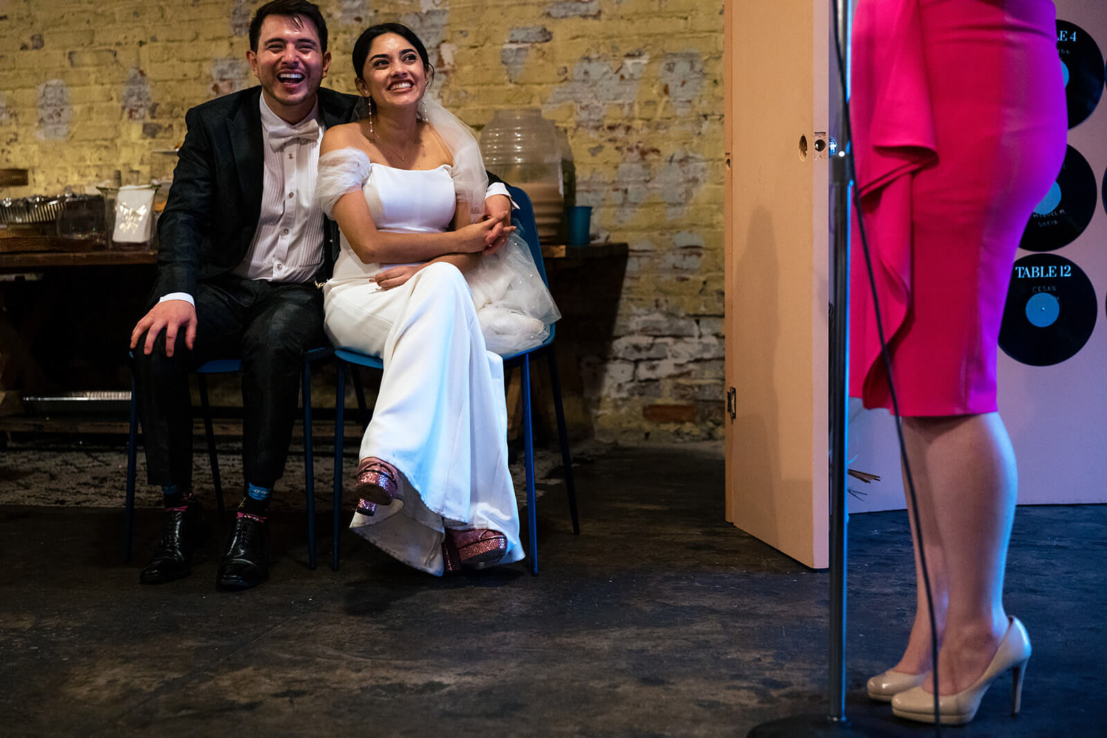 newlyweds laugh during speeches