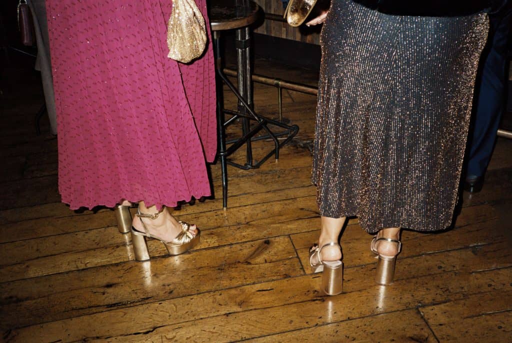 wedding guests gold shoes on 35mm film