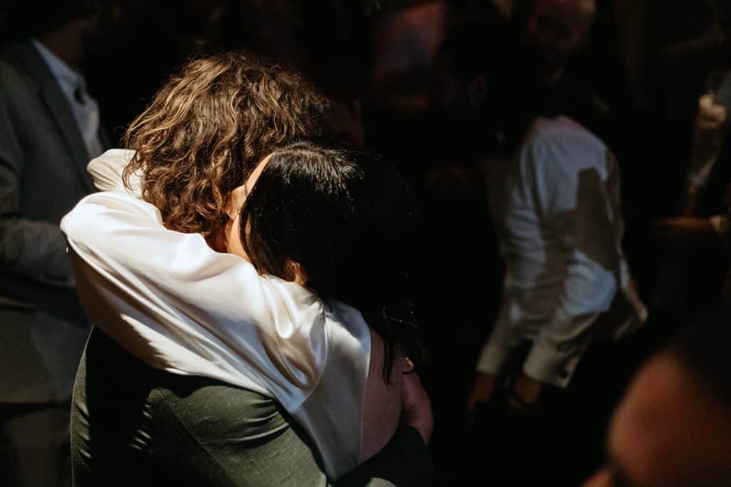 bride and groom embrace on the dancefloor