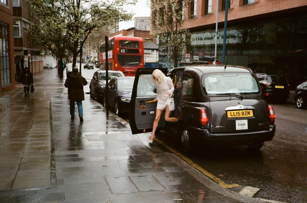 bride exits black cab in london on 35mm film