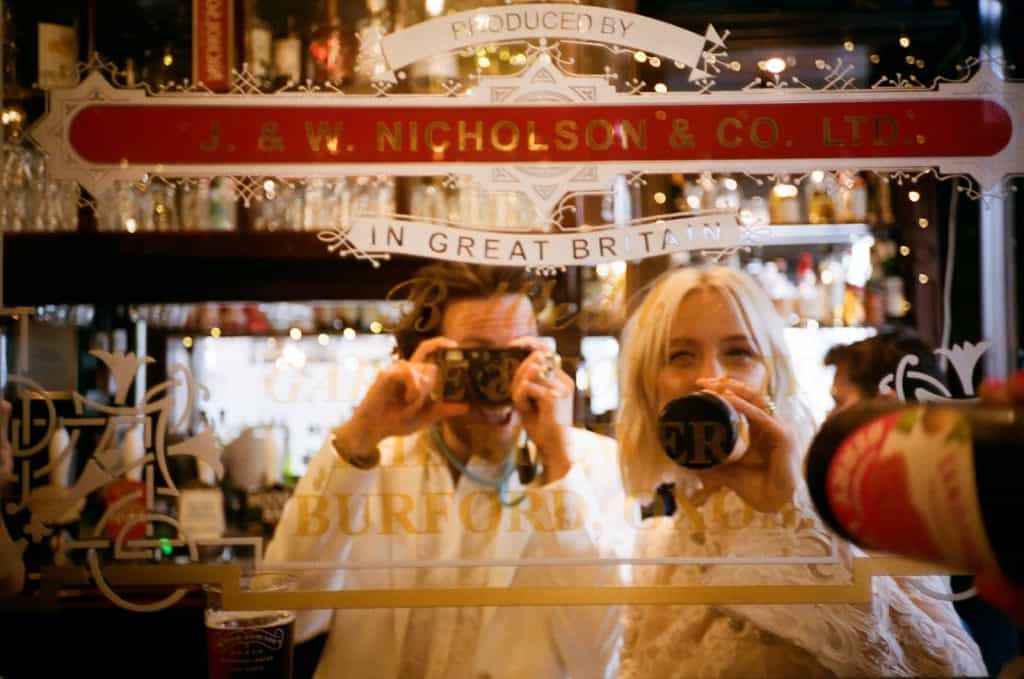 bride and groom selfie in vintage mirror at the dog and duck soho