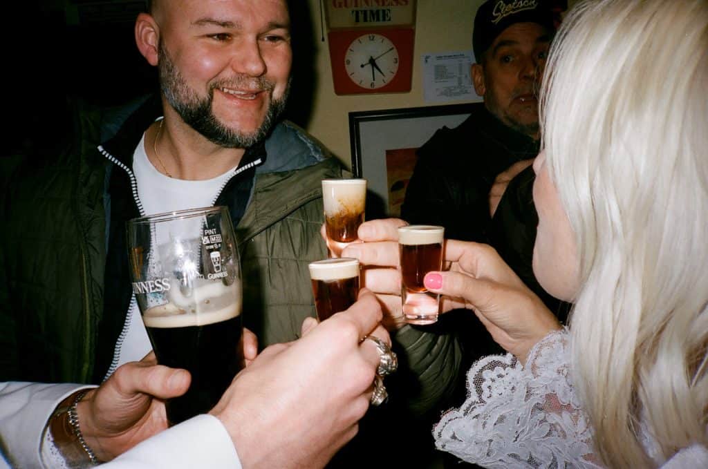 round of shots for newlyweds 35mm