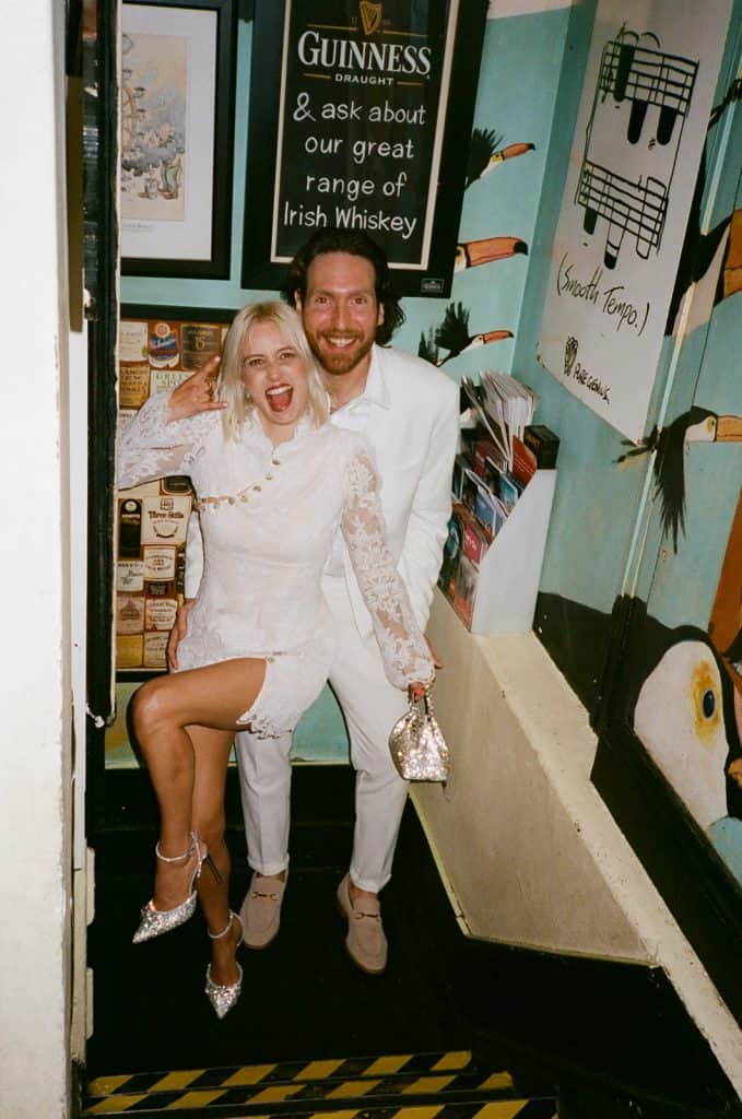 newlyweds pose in the toucan pub in london soho