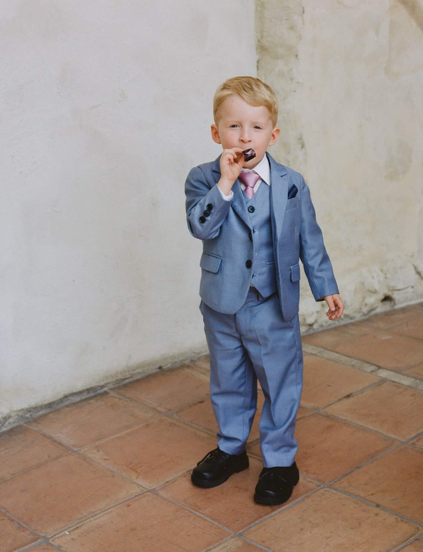 wedding guest blowing a streamer on medium format film