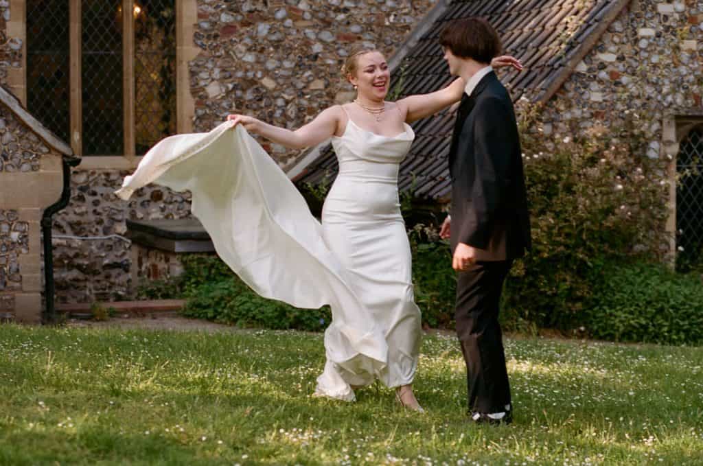 newlyweds dancing in churchyard
