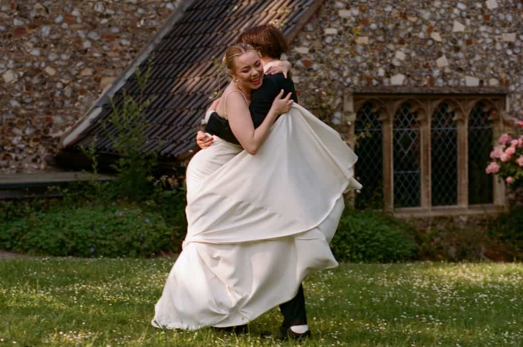 bride embracing groom
